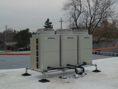 A/C condensing units mounted on their 'big foot' stand