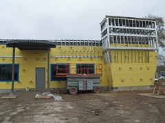 continuing work on the facade of the addition