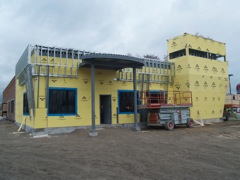 exterior board completed on main entrance side of building